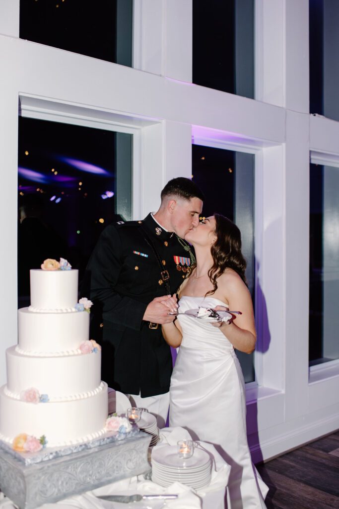 bride and groom cutting the cake during wedding reception