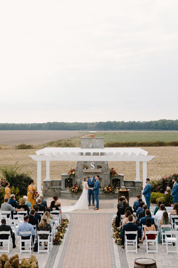 bride walking down the aisle for fall wedding
