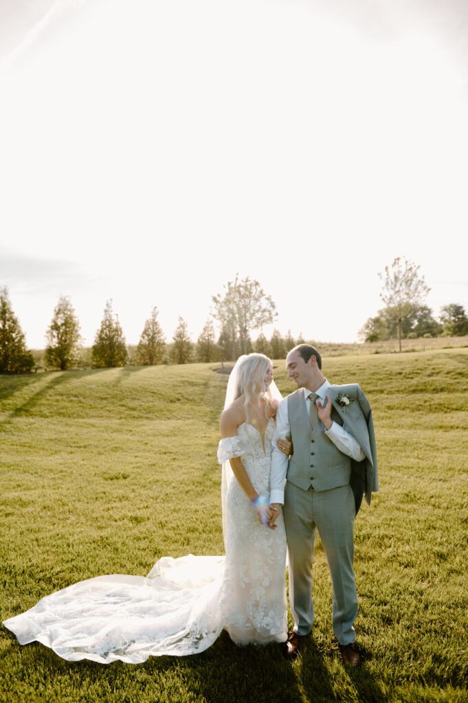 romantic bride and groom photos at terrain gardens for a garden wedding in the summer