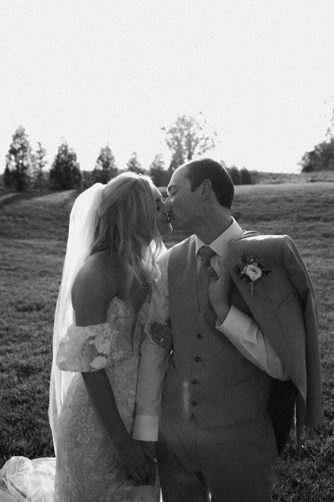 romantic bride and groom photos at terrain gardens for a garden wedding in the summer
