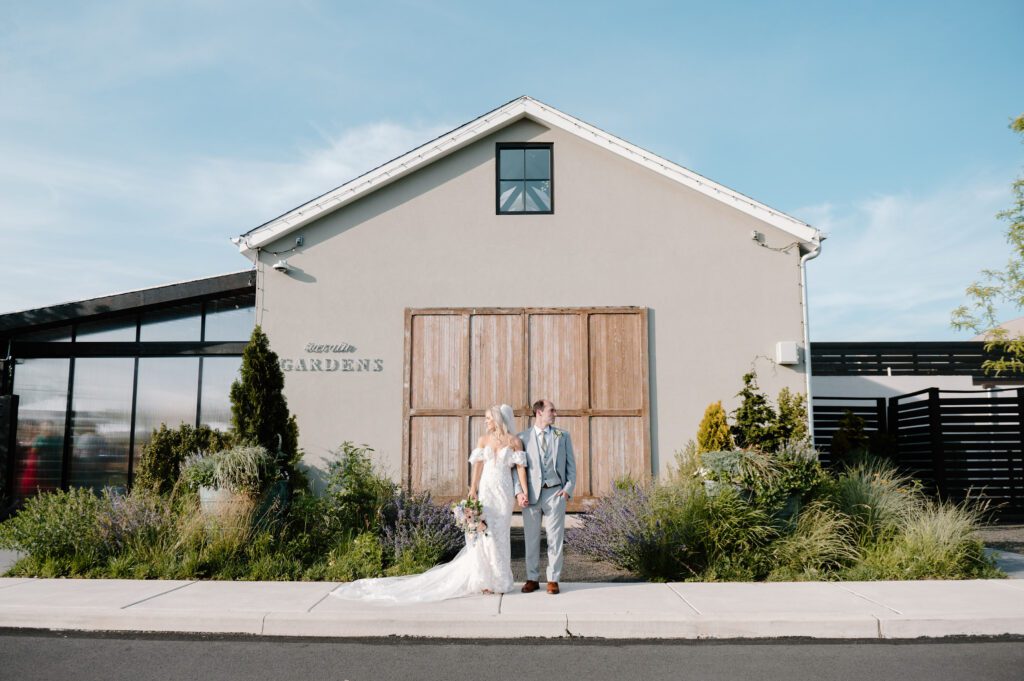 romantic bride and groom photos at terrain gardens for a garden wedding in the summer