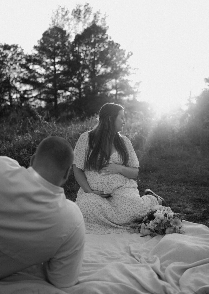 couple photos with baby bump honoring rainbow baby