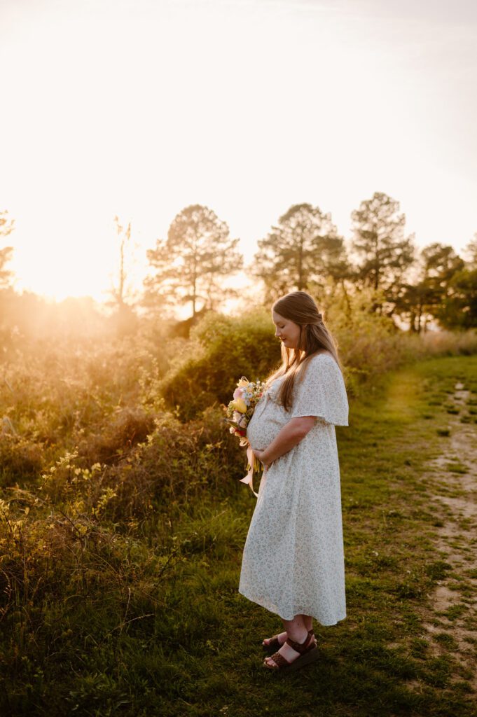 couple photos with baby bump honoring rainbow baby
