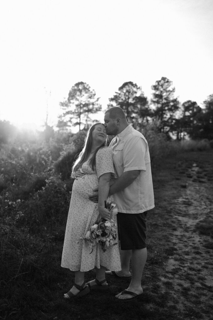 couple photos with baby bump honoring rainbow baby