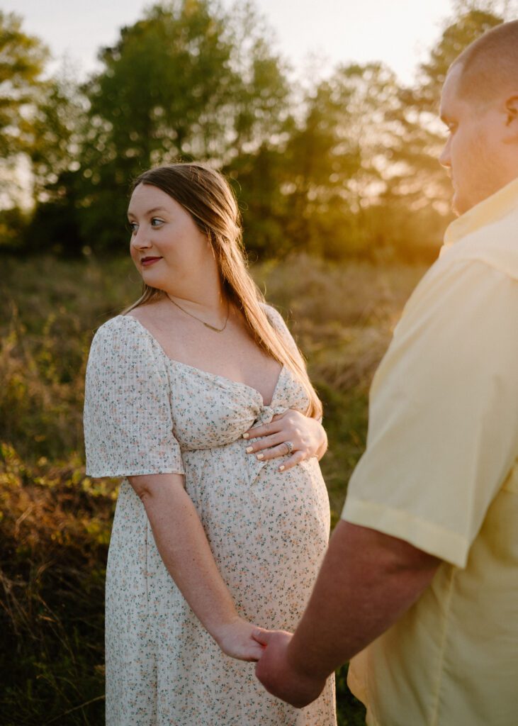 couple photos with baby bump honoring rainbow baby