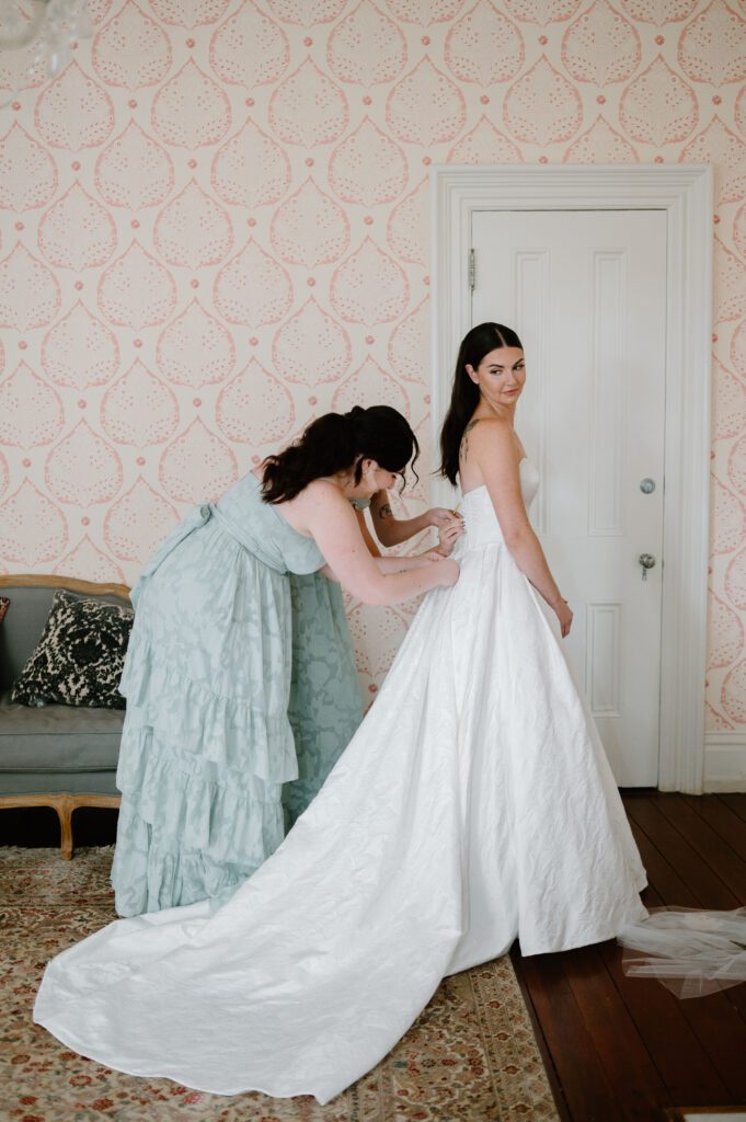 bride final touches getting ready wedding photos