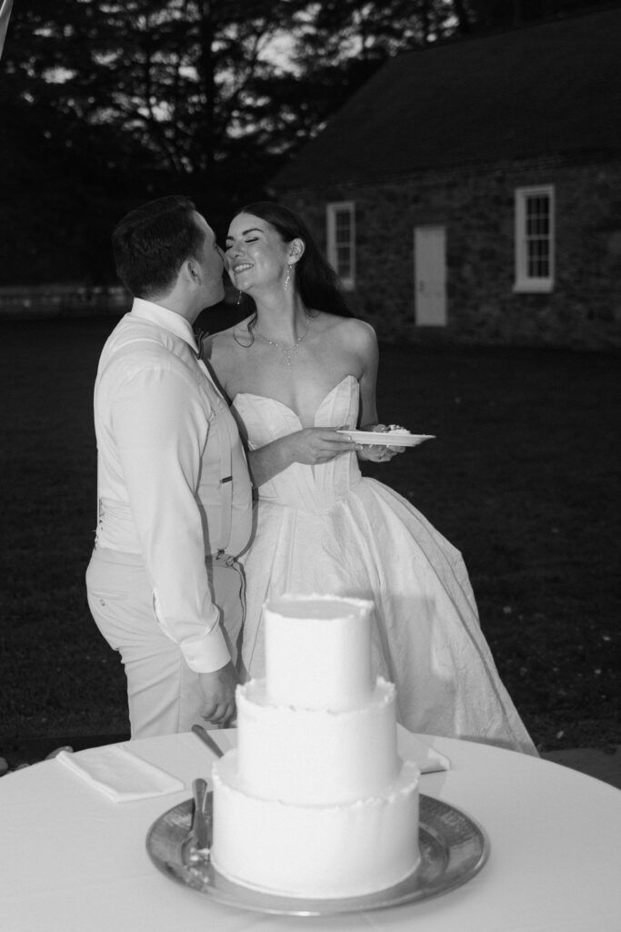 bride and groom cutting the wedding cake
